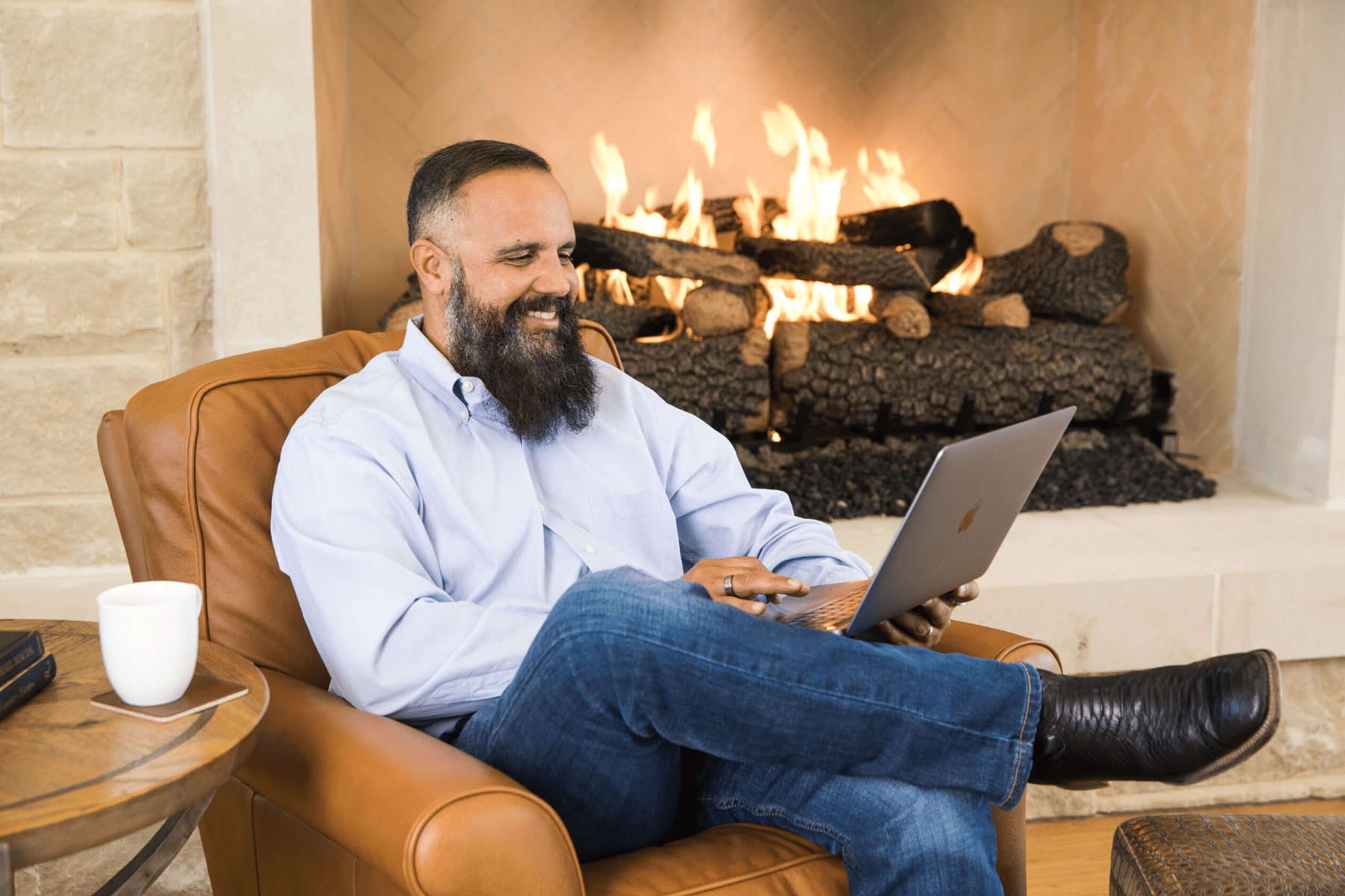 Man Sitting by Fireplace