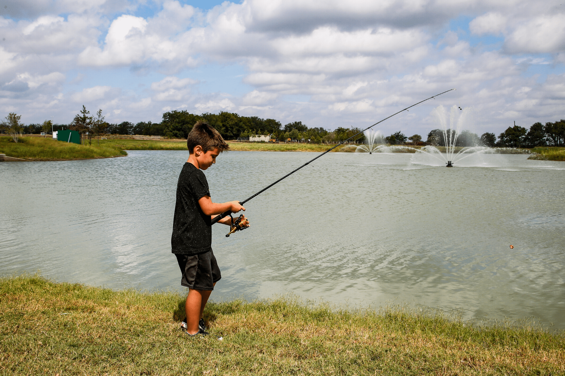 Boy Fishing at Lake